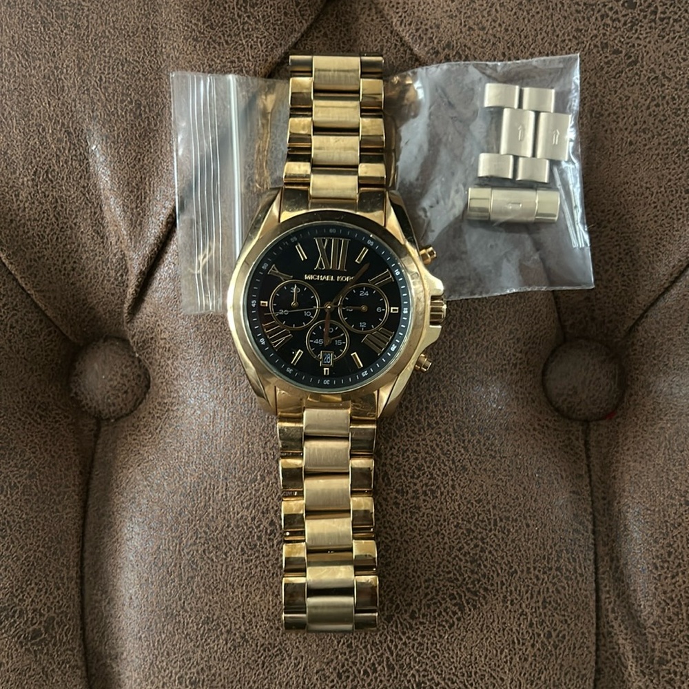 Gold and black Michael Kors watch